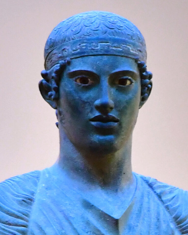 Bronze charioteer of Delphi face closeup